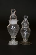 TWO ENGLISH GLASS DRY MUSTARDS, LATE 18th century, the taller with ball finial over a domed cover,