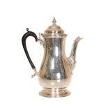 A GEORGE V SILVER COFFEE POT, George Howson, Sheffield 1929, of baluster form. 25cm high, gross 25.