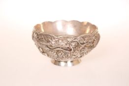 A CHINESE SILVER DOUBLE WALLED BOWL, embossed with a three-claw dragon, seal marks. 7.