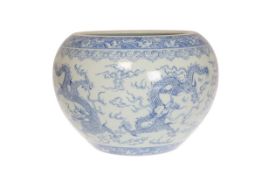 A CHINESE BLUE AND WHITE PORCELAIN JARDINIERE, decorated with dragons.