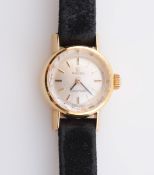 A LADY'S OMEGA LADYMATIC GOLD WRISTWATCH, the circular dial with baton markers, in original box.