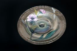 A CONTINENTAL PAINTED GLASS PLATE, decorated in coloured enamels with a dragonfly and poppies.