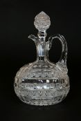 A CUT-GLASS CLARET JUG, PROBABLY SECOND QUARTER OF THE 19th CENTURY, of flask form,
