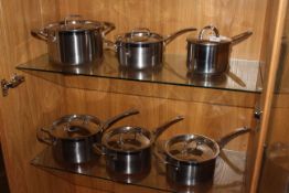 Set of six 'Le Creuset' stainless steel kitchen pans