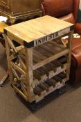 Eight bottle wine rack in the form of an industrial trolley