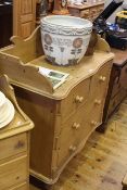 Pine chest of two short above two long drawers with shaped ¾ gallery back,