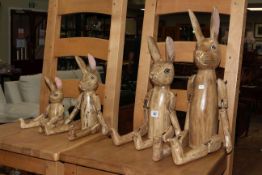 Set of four graduated jointed wood hares