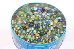 Tin of glass marbles