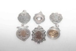 Six silver fobs