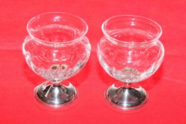Pair of glass vases each with silver base
