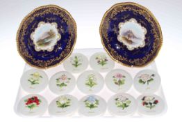 Pair of Coalport plates and twelve floral encrusted month wall plaques