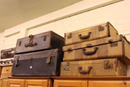 Two vintage trunks and five suitcases