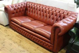 Red leather deep buttoned three seater Chesterfield settee