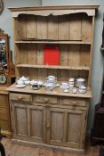 Pine shelf back two door dresser and collection of tea china,