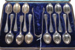 Set of eleven Victorian silver teaspoons and tongs, Edward Hutton, London 1882,