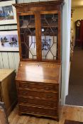 Mahogany bureau bookcase having two astragal glazed doors above a fall front with four drawers