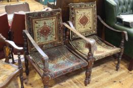 Pair Victorian campaign style open armchairs