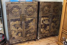 Pair of Chinese lacquered two door cabinets, late 19th or early 20th Century.