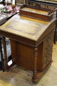 Victorian walnut Davenport having four side drawers and turned pillars