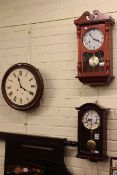 Two modern wall clocks,