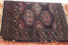 Persian design rug with a burgundy ground 1.80 by 0.