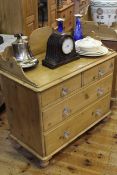 Victorian waxed pine chest of two short above two long drawers with shaped ¾ gallery back and glass