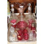 Collection of cranberry and other glassware including decanters, atomisers,