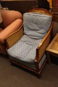 Double bergere panelled armchair on ball and claw feet