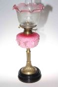 Victorian brass column oil lamp with moulded opaque ruby glass reservoir