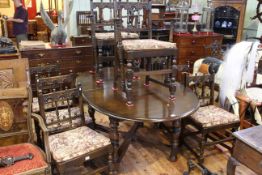 Ercol Old Colonial oval extending dining table and eight dining chairs including pair carvers