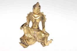 Chinese gilt-bronze figure of Guanyin, the bodhisattva shown seated in a variation of rajalilasand,
