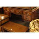 Leather inset mahogany five drawer writing table on cabriole legs