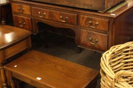 Leather inset mahogany five drawer writing table on cabriole legs