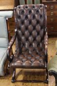 Brown deep buttoned leather scrolled open armchair