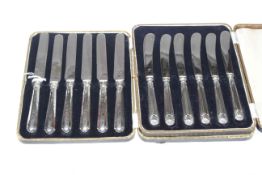 Two cased sets of six silver-handled tea knives
