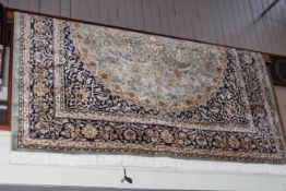 Keshan carpet with a green ground 2.80 by 2.