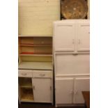 Two vintage kitchen cabinets, circular folding brass topped coffee table,