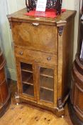 Victorian inlaid walnut writing cabinet having fall front above a drawer with two glazed panel