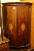 Inlaid mahogany two door bow front standing corner cupboard and string inlaid mahogany two door