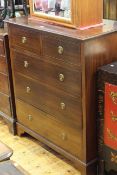 Edwardian mahogany and chequer inlaid chest of two short above three long drawers on bracket feet,