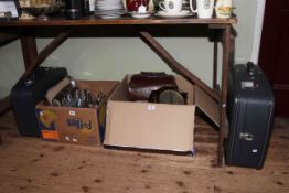 Two boxes with oak clock, barometer, linen, EP and Stainless wares, suitcases,