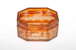Amber glass casket with engraved decoration