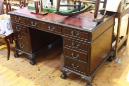 Mahogany Chippendale style nine drawer pedestal desk on ball and claw legs,