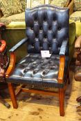 Blue deep buttoned leather arched back open armchair