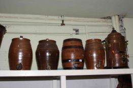 Three Stoneware barrels, wood barrel, copper urn, stoneware bottles, pewter measures, metalwares,