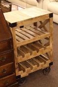 Eight bottle wine rack in the form of an industrial trolley