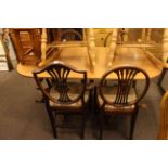 Set of four mahogany Hepplewhite style dining chairs and twin pedestal dining table