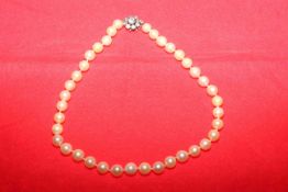 Cultured pearl necklace with paste clasp,