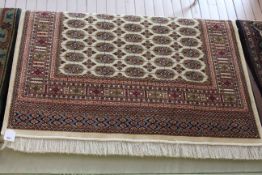 Bokhara rug with a beige ground 1.90 by 1.