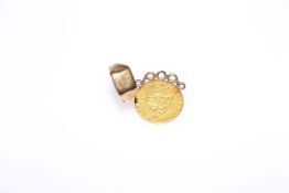 George III gold spade guinea, with pendant fitting; and a 9 carat gold ring (2) Gross 12.